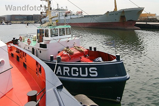 Tug Argus alongside the new tug Triton, Haringhaven, IJmuiden